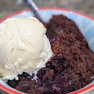 blackberry chocolate cobbler in the dutch oven